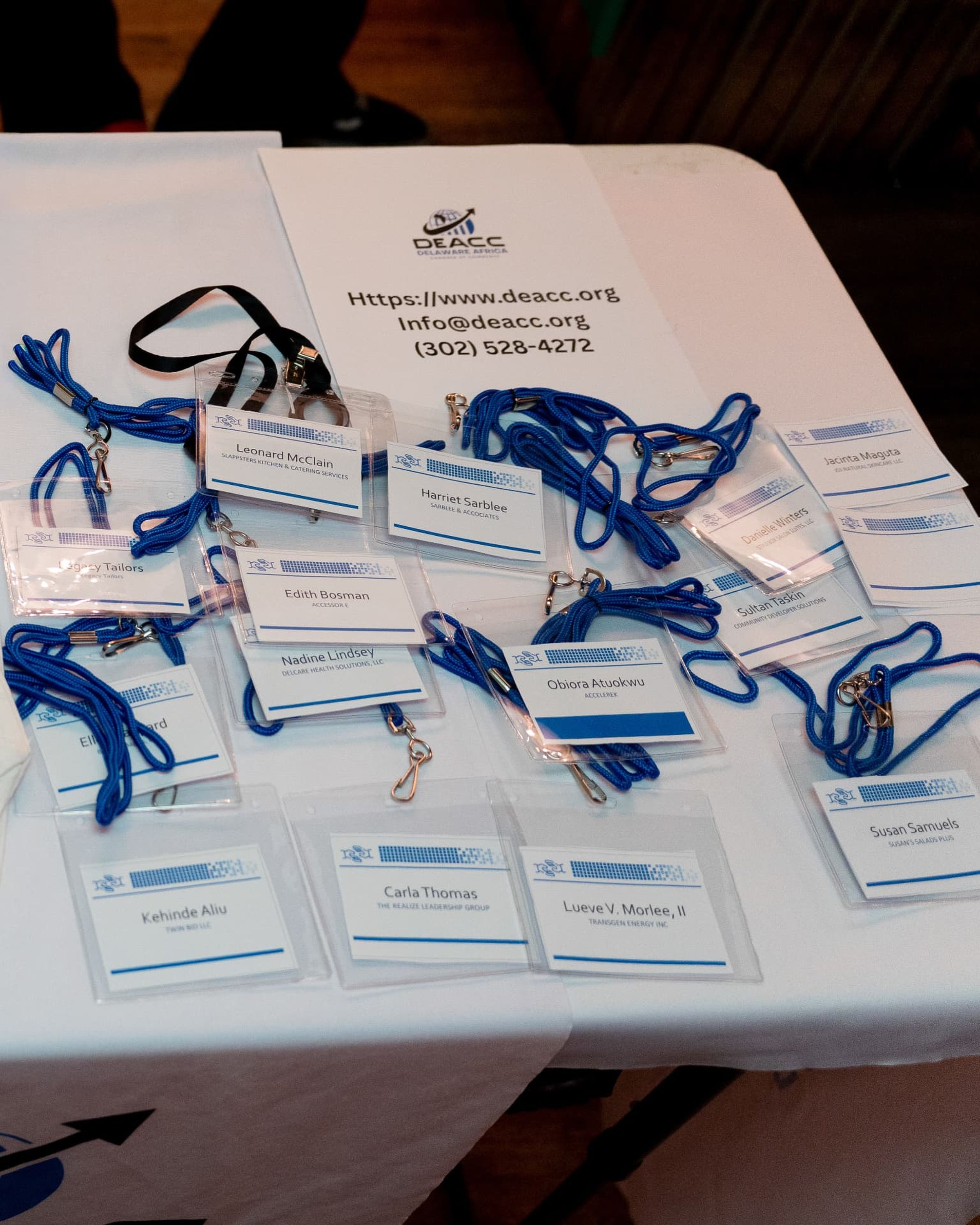 Name badges and a printed information sheet on a table