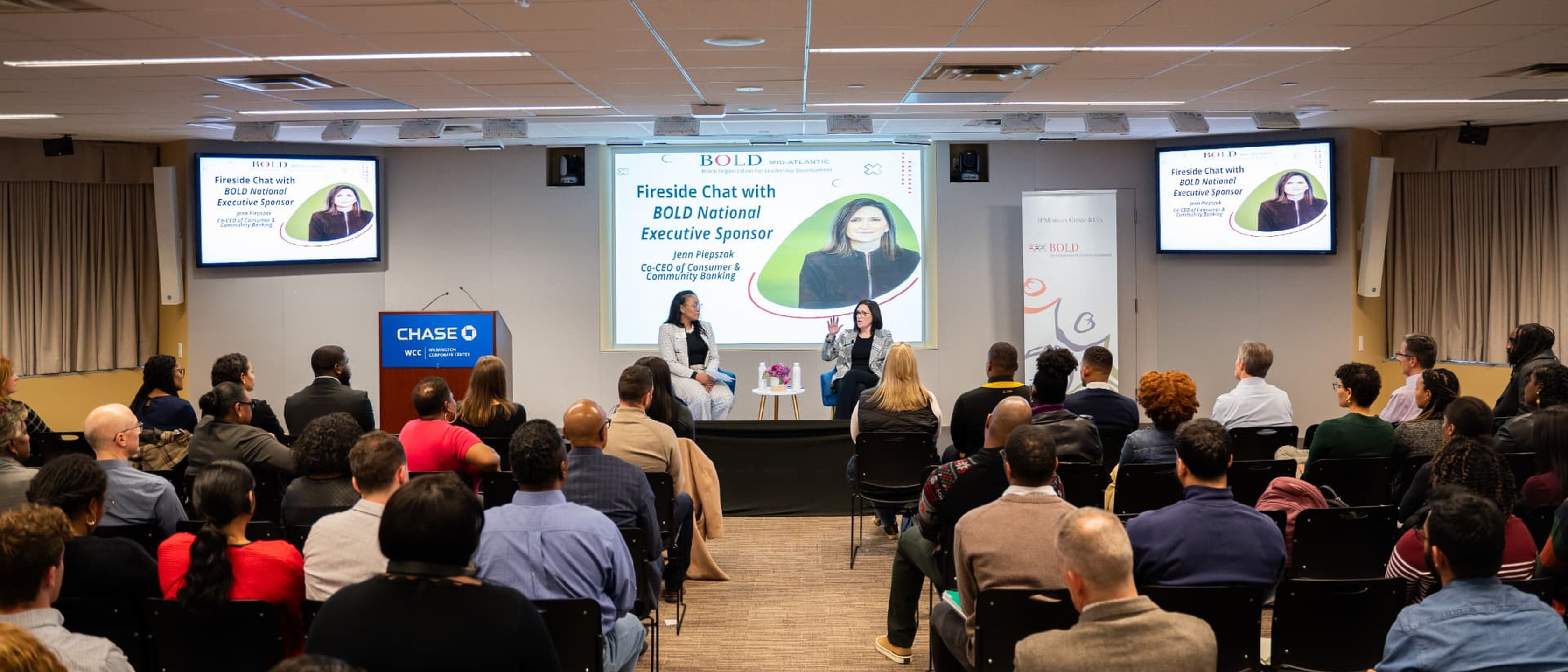 Fireside chat before a seated audience