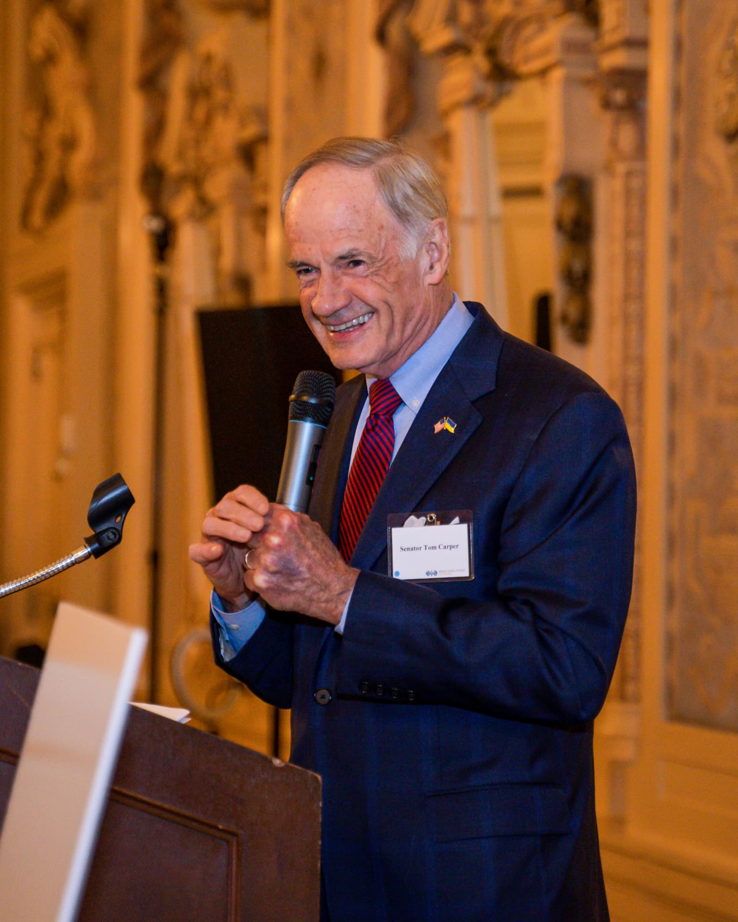 Man speaking at a lectern