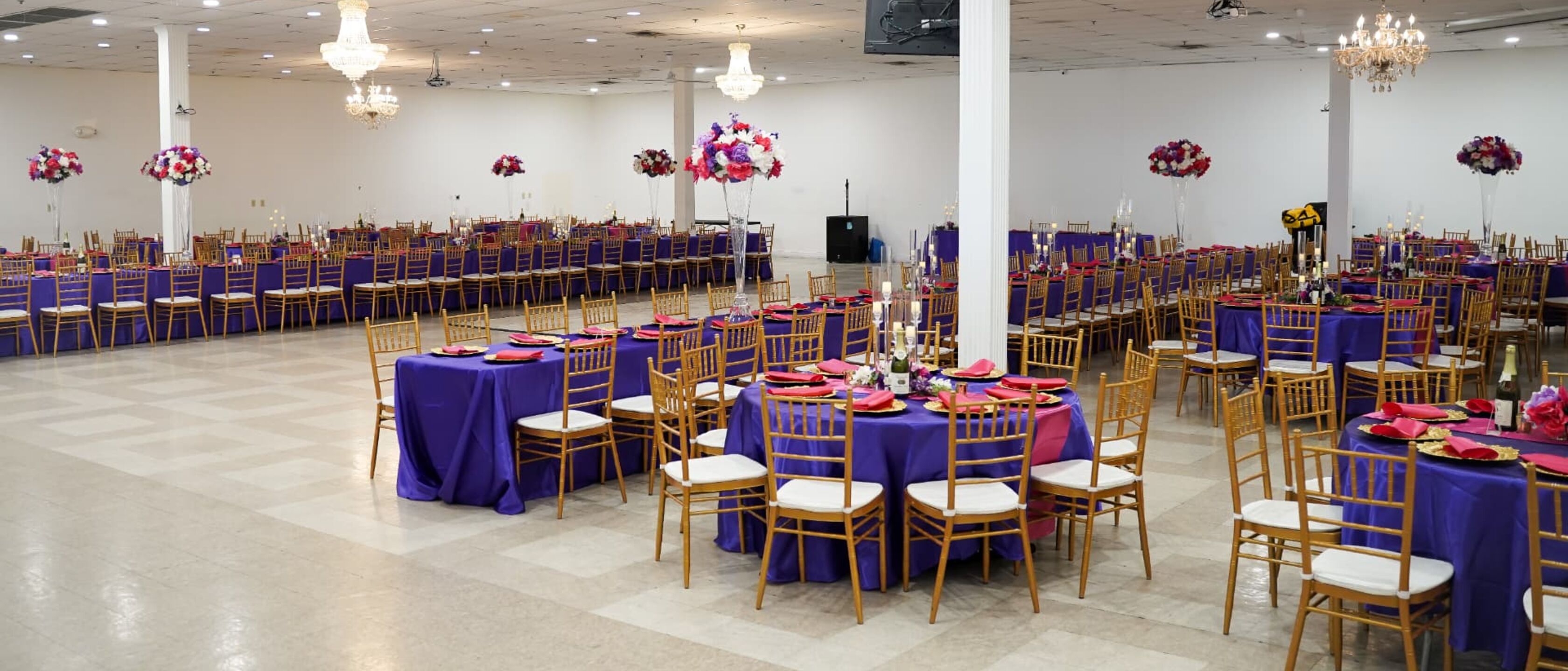 Empty banquet hall prepared with tables and chairs